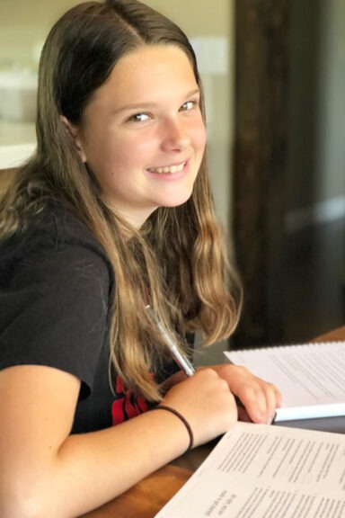 Girls Inc. girl completing independent study homework
